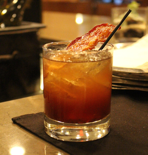Italian smoky Manhattan cocktail with bacon